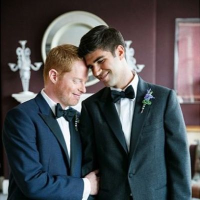 Jesse Tyler Ferguson and Justin Mikita took a picture in a matching suit and hands intertwined.